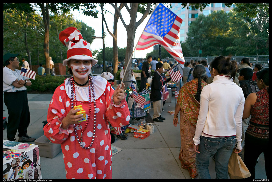 Woman in clown costume waiving American Flag, Independence Day. San Jose, California, USA