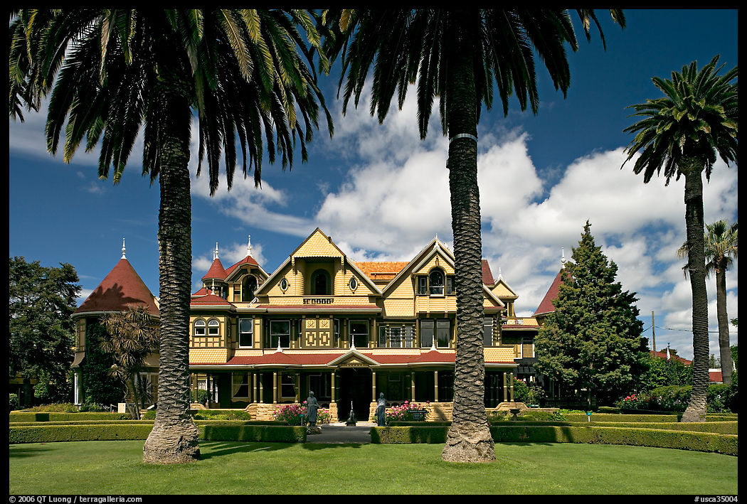 Palm trees and mansion facade. Winchester Mystery House, San Jose, California, USA
