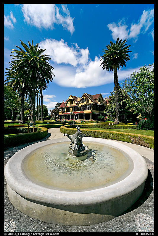 Wide view of fountain and mansion. Winchester Mystery House, San Jose, California, USA