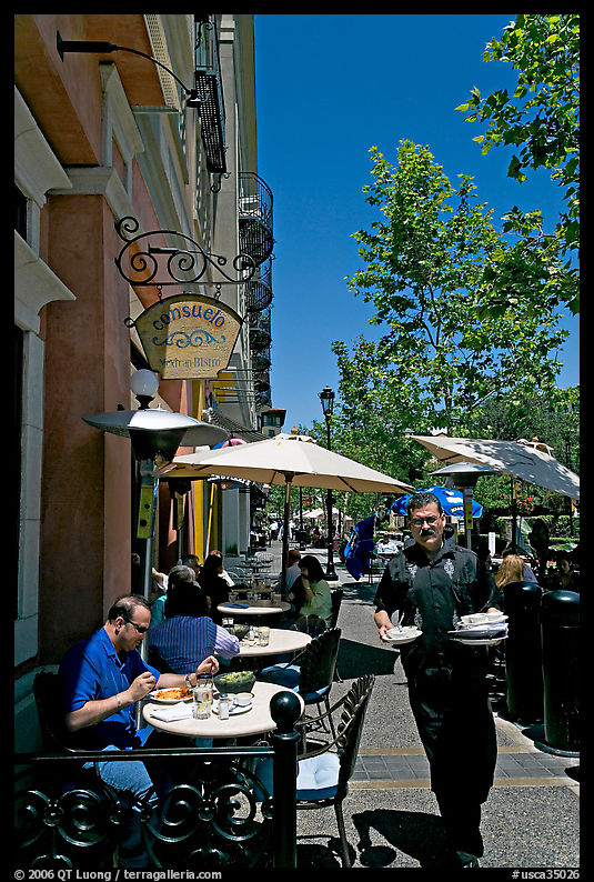 Streetside restaurant terrace and waiter, Santana Row. San Jose, California, USA