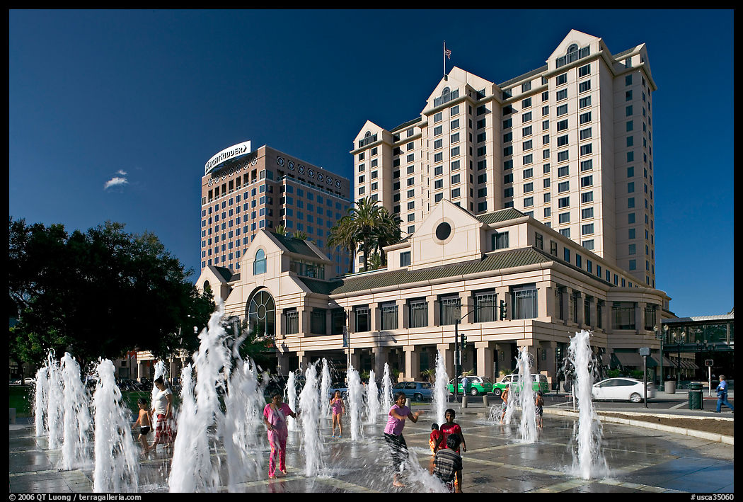 Children playing in fountain on Plaza de Cesar Chavez. San Jose, California, USA