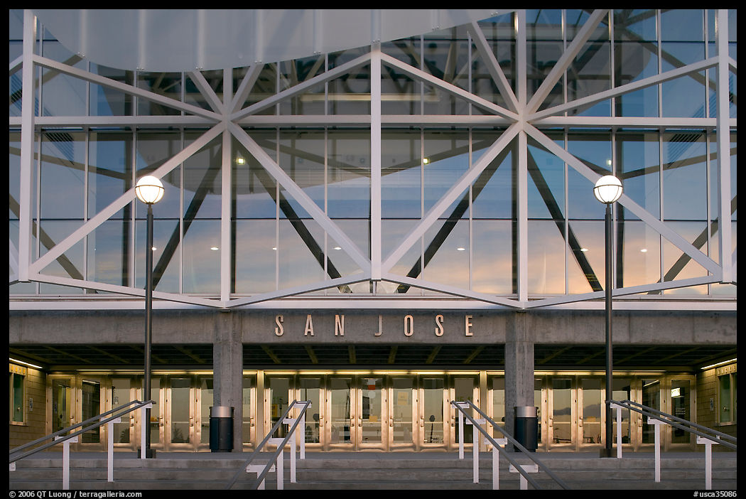 Facade of HP pavilion with San Jose sign reflecting sunset colors. San Jose, California, USA
