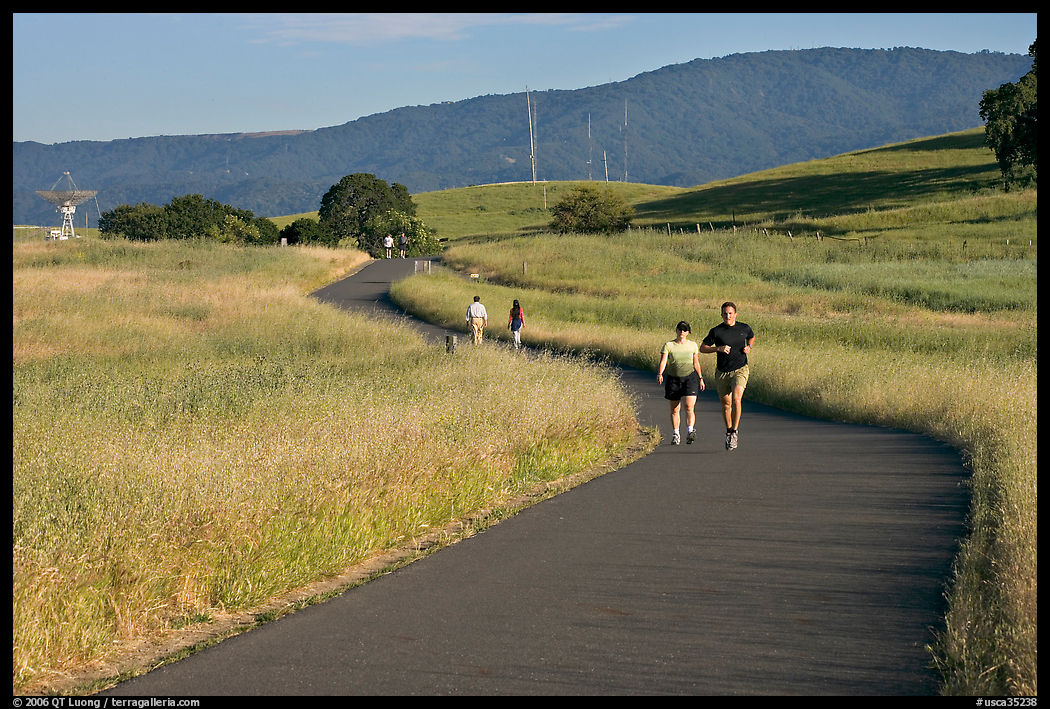 People jogging on trail in the foothills. Stanford University, SF Bay area, California, USA