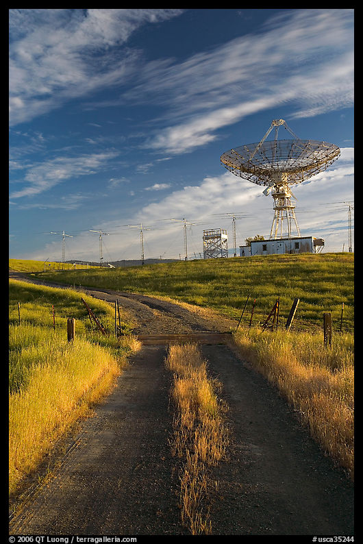 Gravel road leading to parabolic antenna, late afternoon. Stanford University, SF Bay area, California, USA