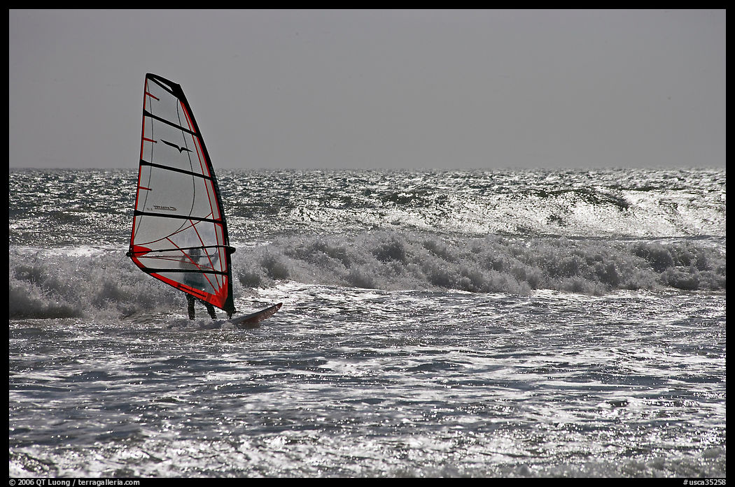 Windsurfer on silvery ocean, Waddell Creek Beach. SF Bay area, California, USA