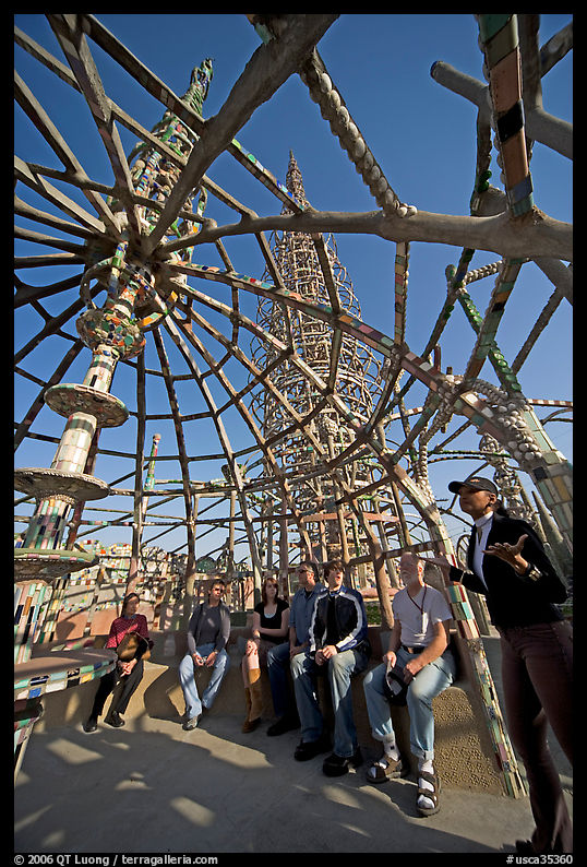 Tour guide and group in the Gazebo of the Watts Towers. Watts, Los Angeles, California, USA
