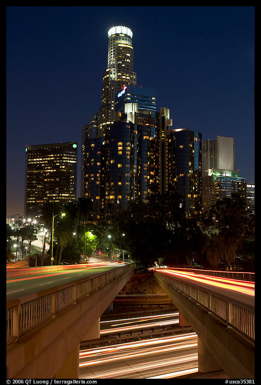 Bridge above Harbor Freeway and US Bank building at night. Los Angeles, California, USA