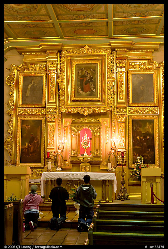 Prayer at altar in Mission Chapel. Los Angeles, California, USA