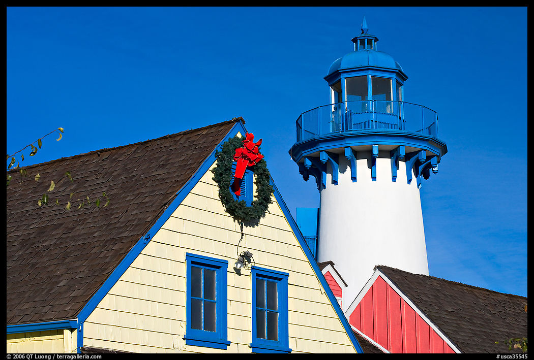 Brighly painted houses and lightouse, Fishermans village. Marina Del Rey, Los Angeles, California, USA