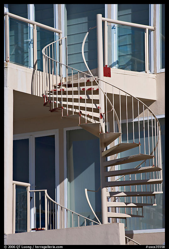 Facade detail of beach house with spiral stairway. Santa Monica, Los Angeles, California, USA