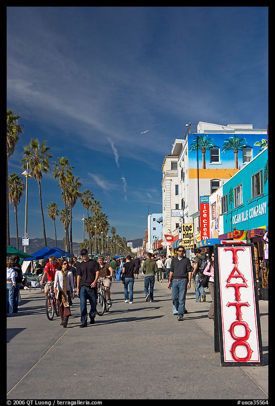 Tatoo sign and colorful Ocean Front Walk. Venice, Los Angeles, California, USA