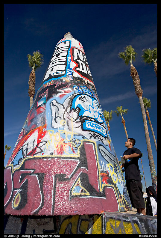Man creating  graffiti art. Venice, Los Angeles, California, USA