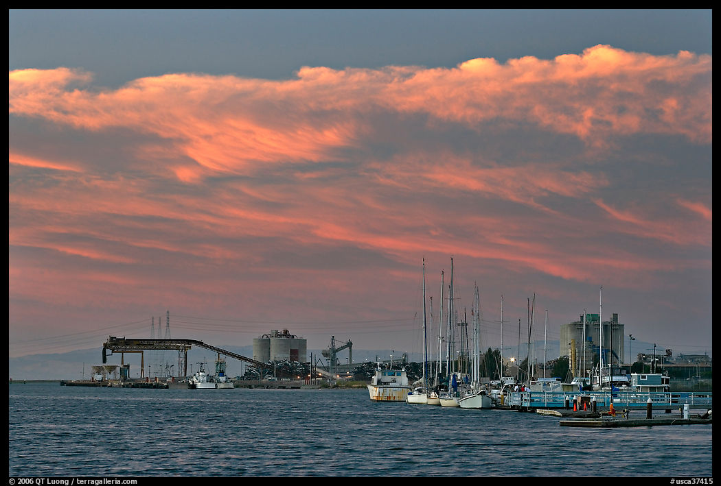 Yachts and industrial installations, port of Redwood, sunset. Redwood City, SF Bay area, California, USA