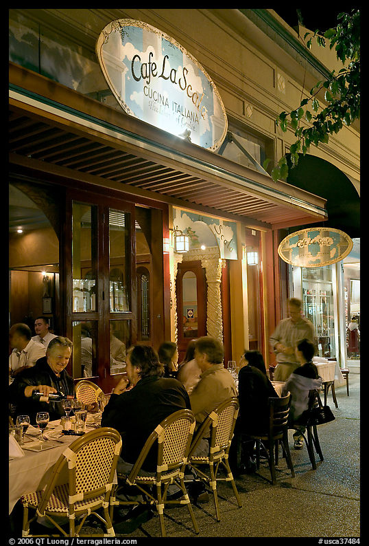 Italian restaurant with diners by night. Burlingame, SF Bay area, California, USA