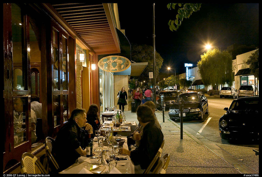 Sidewalk with Outdoor restaurant table and people walking. Burlingame, SF Bay area, California, USA