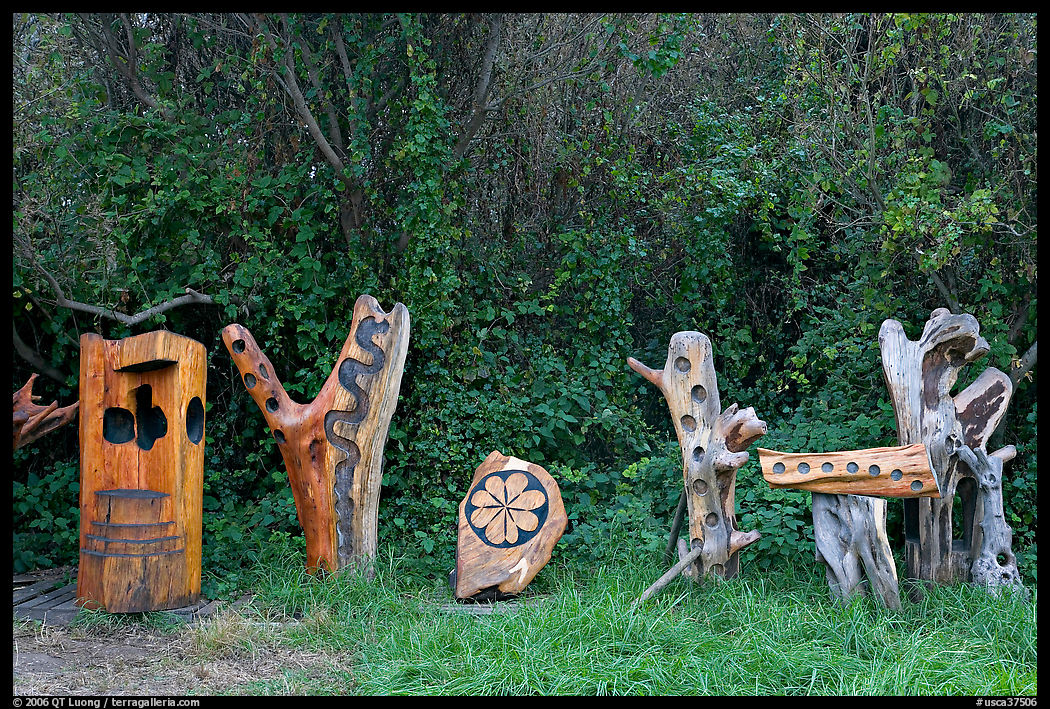Wood carvings in garden. Half Moon Bay, California, USA
