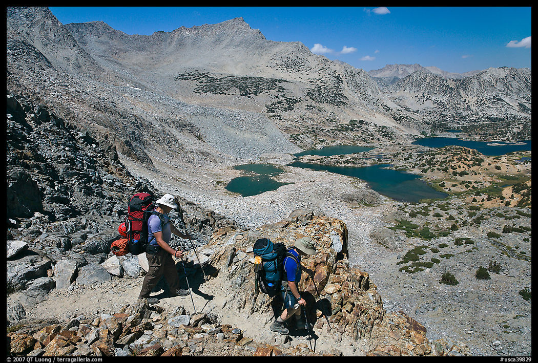 Backpackers going down from Bishop Pass, John Muir Wilderness. California, USA