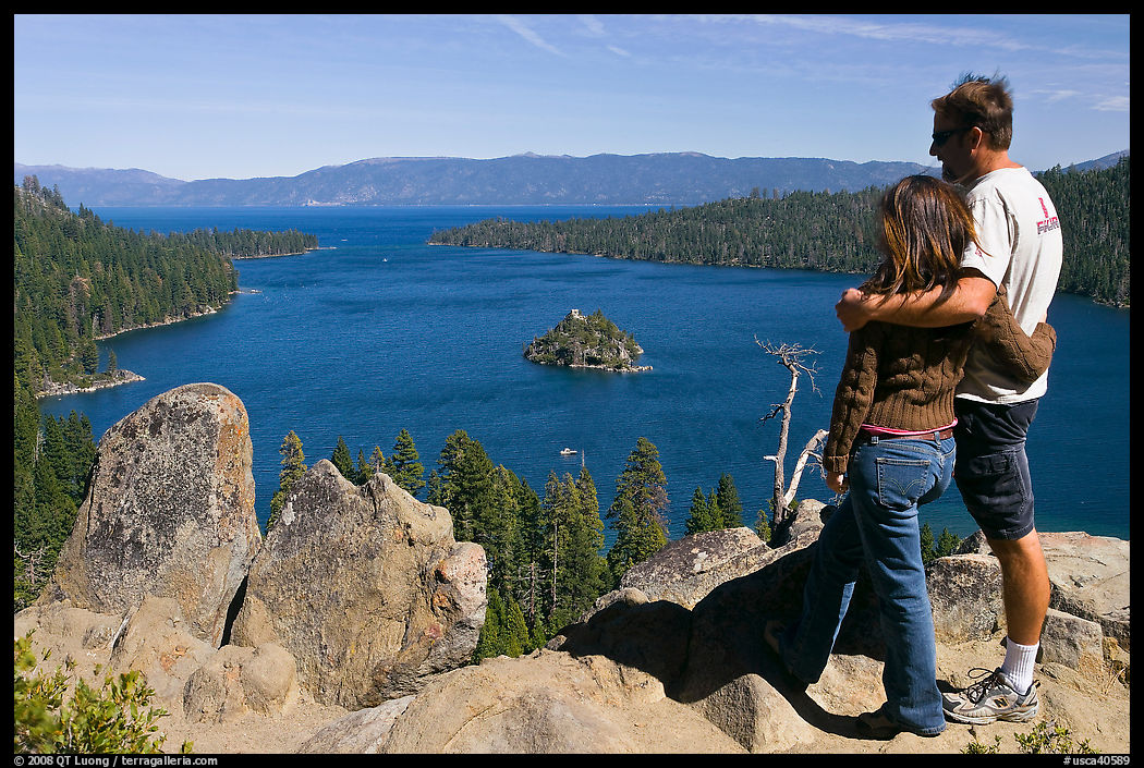 Couple standing above Emerald Bay, Lake Tahoe, California. USA