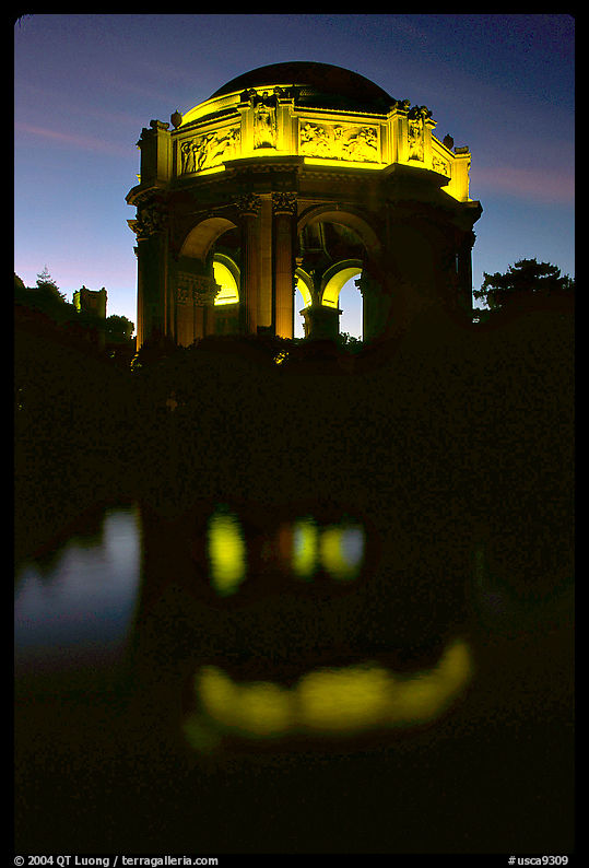 Rotunda of the Palace of Fine arts reflected in lagoon at  night. San Francisco, California, USA