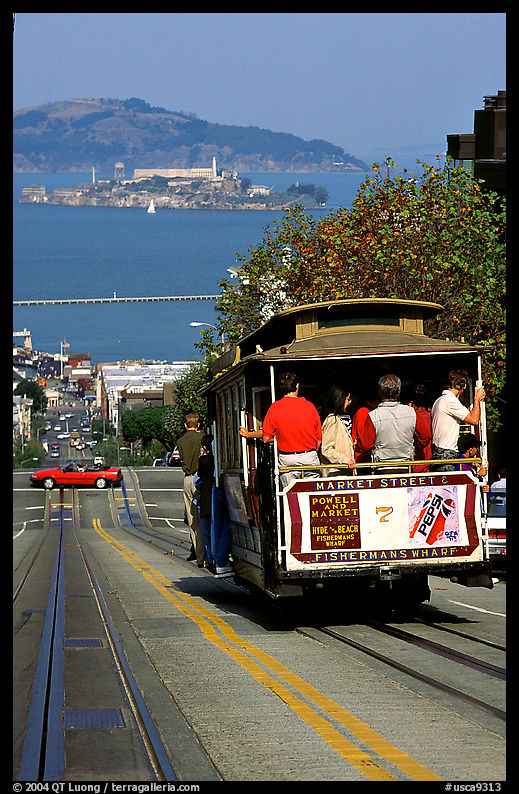 Cable car on Hyde Street, with Alcatraz Island in the background. San Francisco, California, USA