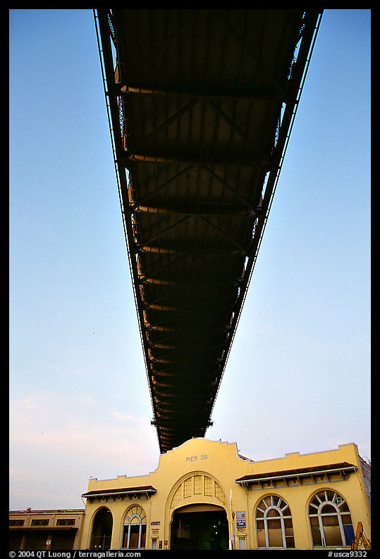Bay Bridge dwarfs Pier 26 building. San Francisco, California, USA