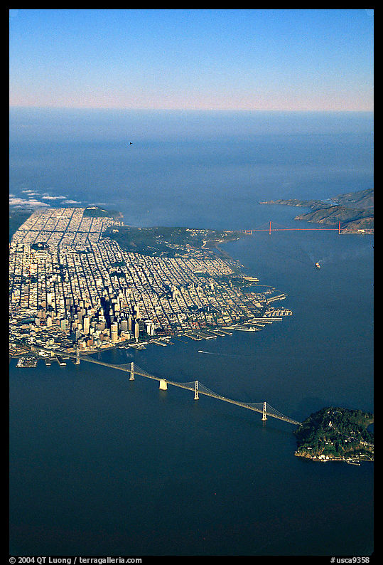 Aerial view of the Bay Bridge, the city, and  the Golden Gate Bridge. San Francisco, California, USA