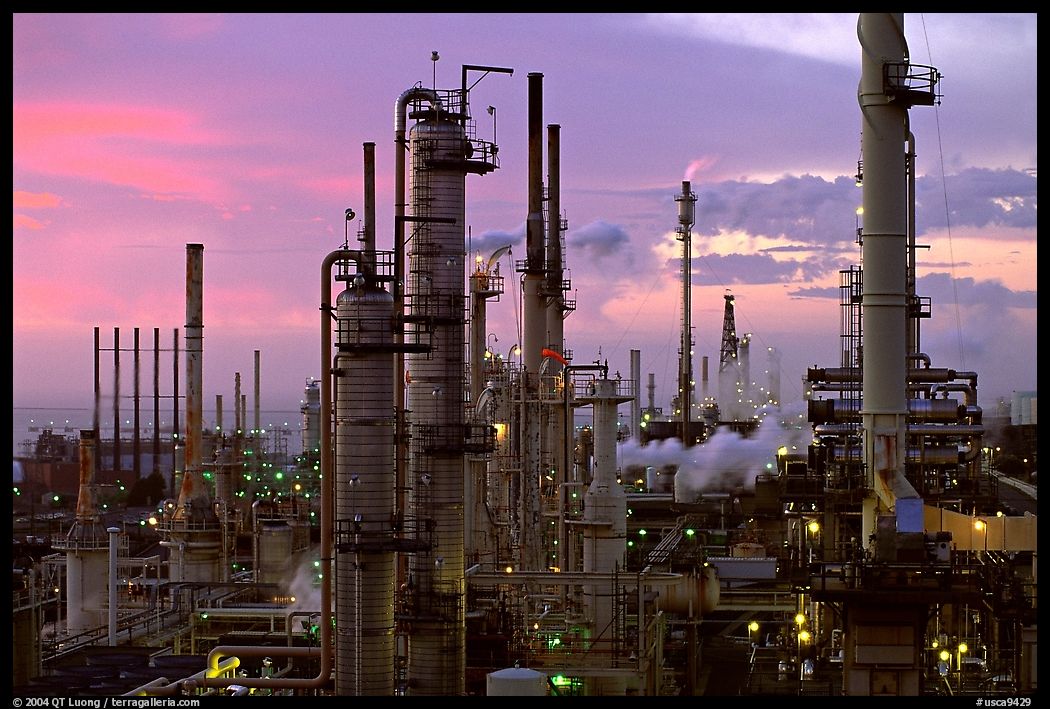 Chimneys of industrial Oil Refinery near Rodeo at dusk. SF Bay area, California, USA