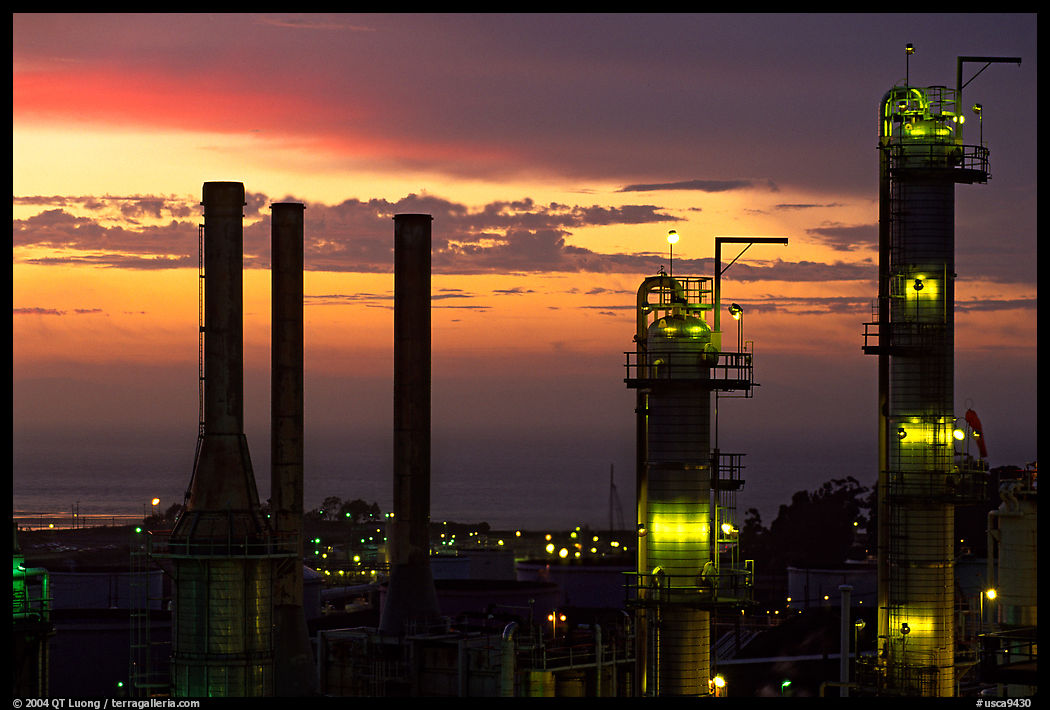 Chimneys of industrial Oil Refinery near Rodeo at sunset. SF Bay area, California, USA