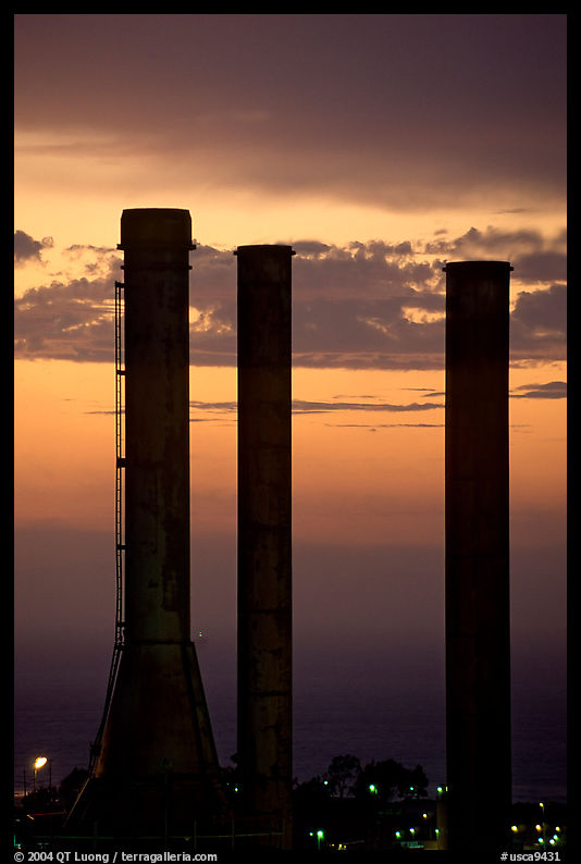 Chimneys of industrial Oil Refinery near Rodeo at sunset. SF Bay area, California, USA