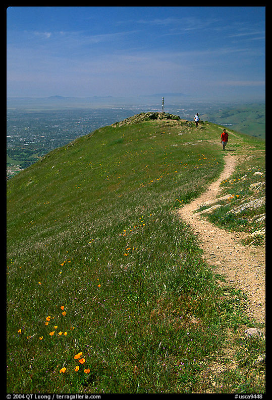 Hiker on trail at the summit of Mission Peak, Mission Peak Regional Park. SF Bay area, California, USA