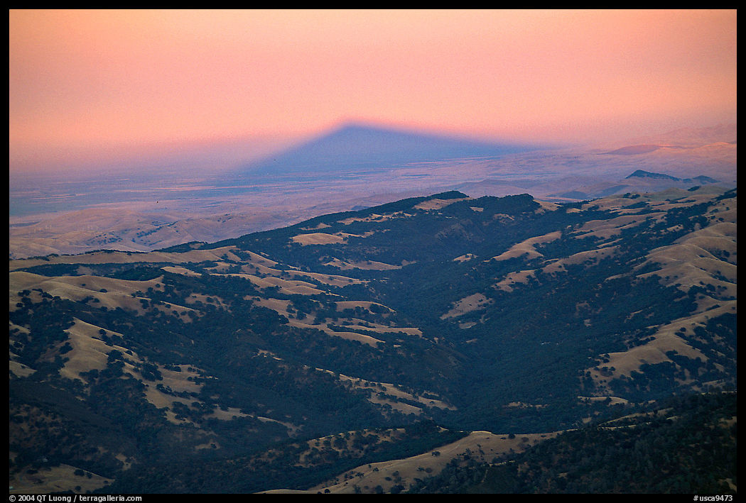 Shadow of Mt Diable projects far into the Central Valley at sunset, Mt Diablo State Park. SF Bay area, California, USA