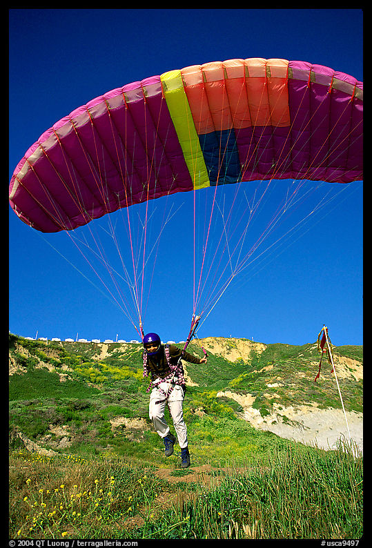 Paraglider launching, the Dumps, Pacifica. San Mateo County, California, USA