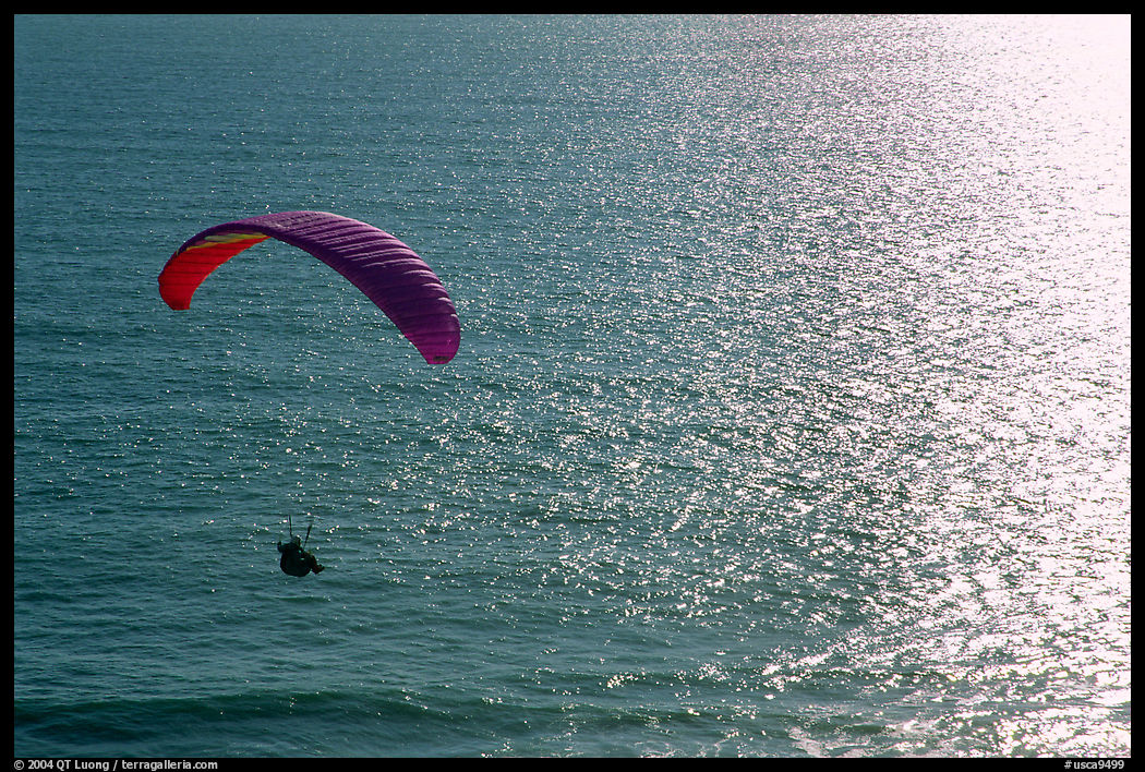 Paraglider above the ocean, the Dumps, Pacifica. San Mateo County, California, USA