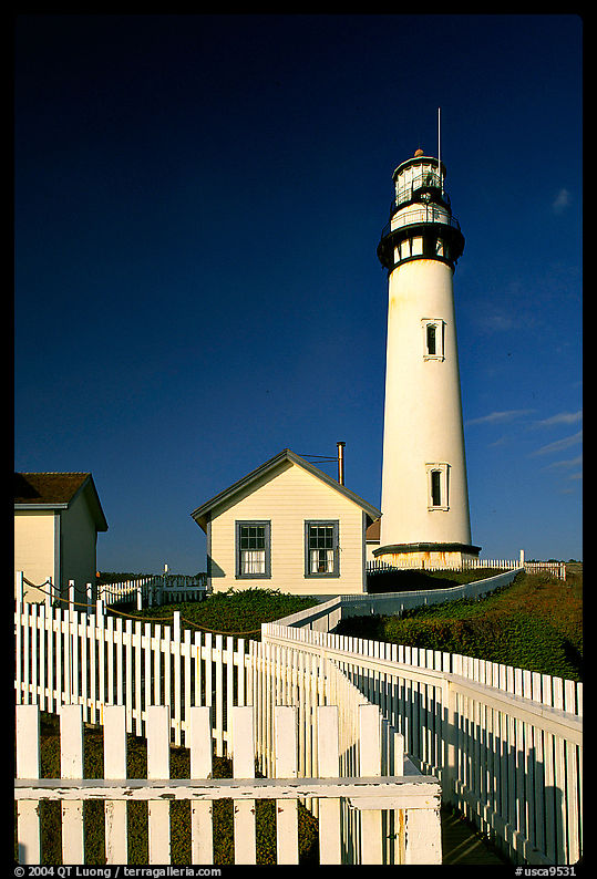 Fence and Pigeon Point Lighthouse, afternoon. San Mateo County, California, USA
