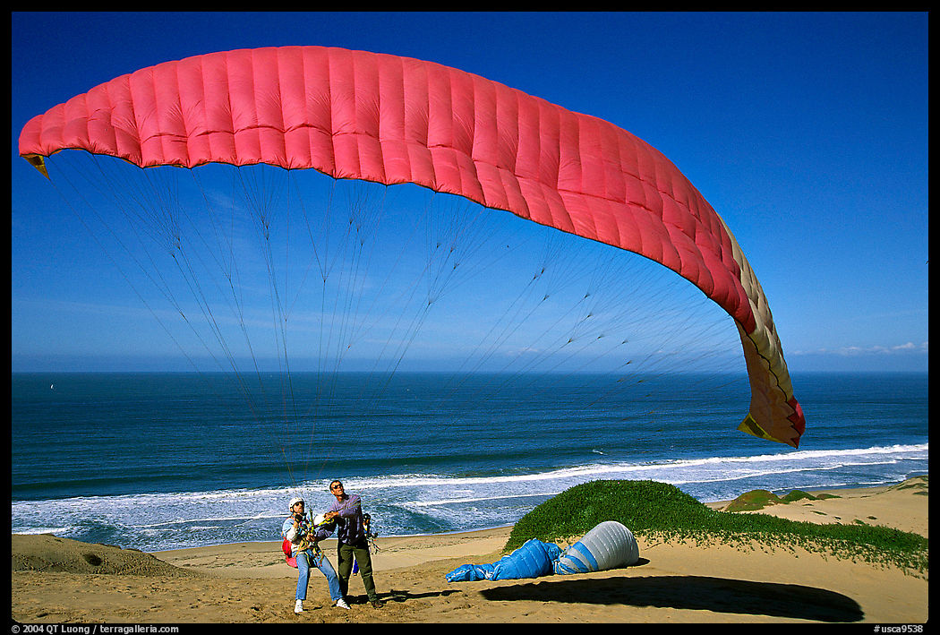 Paragliders practising in the Marina sand dunes. California, USA
