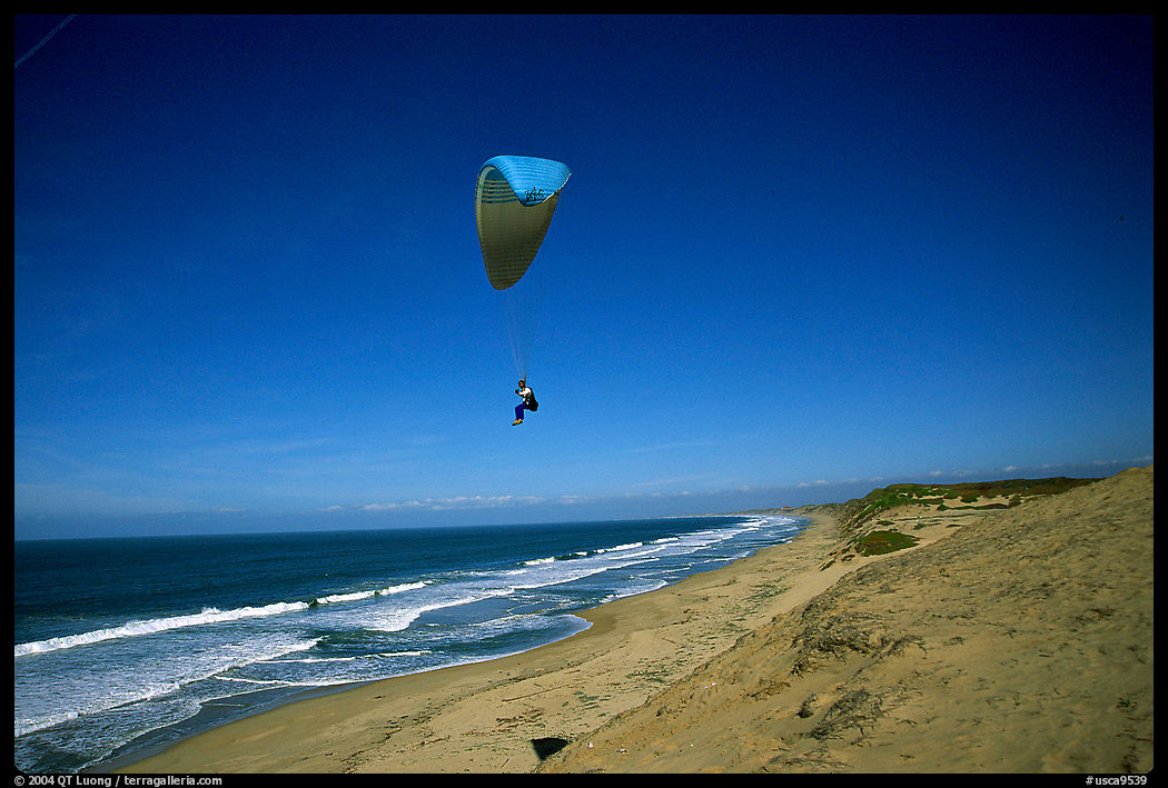 Paragliders soaring above  the Marina sand dunes. California, USA