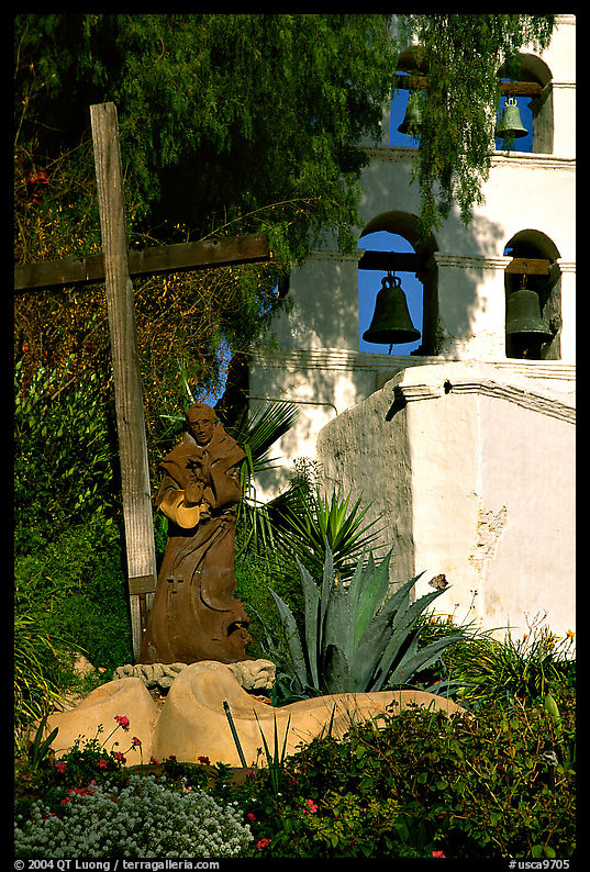 Cross, statue of father, belltower, Mission San Diego de Alcala. San Diego, California, USA