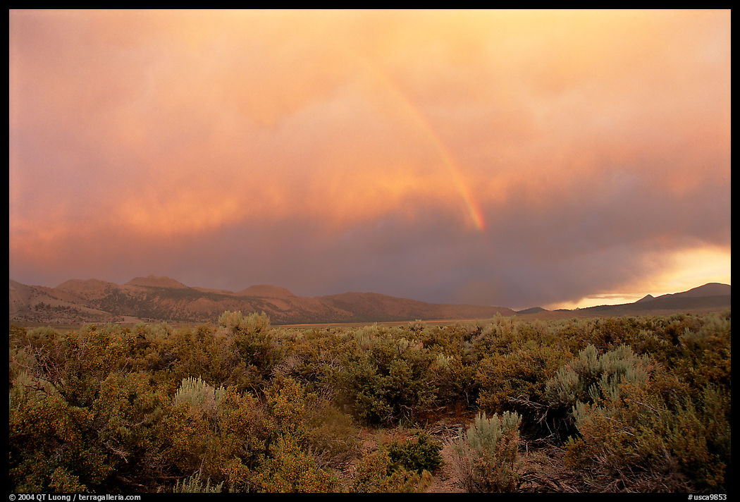 Rainbow and storm over Mono Basin, evening. Mono Lake, California, USA