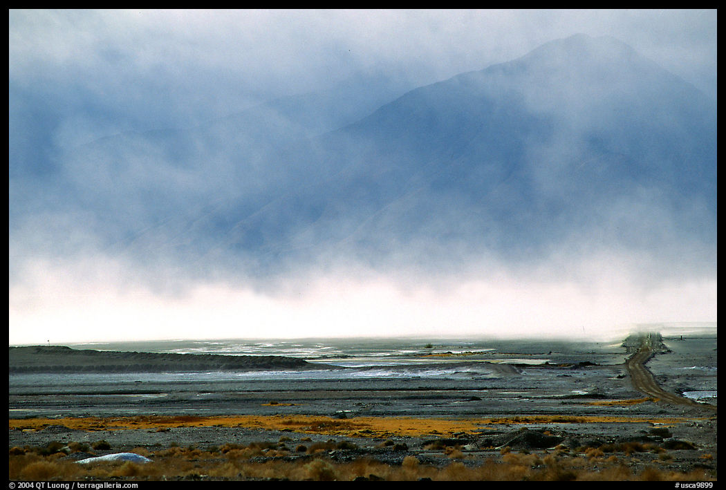 Mineral deposits of dry lake stirred up by a windstorm, Owens Valley. California, USA