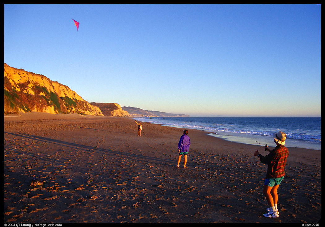 Flying a kite at Santa Maria Beach, late afternoon. Point Reyes National Seashore, California, USA