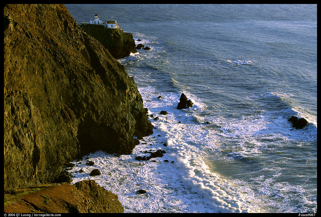 Cliffs, waves,  and Point Bonita Lighthouse, late afternoon. SF Bay area, California, USA