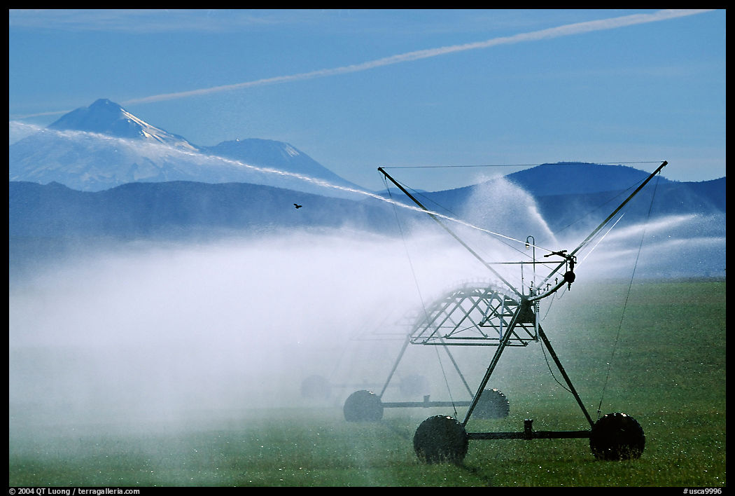 Irrigation machine and Mt Shasta. California, USA