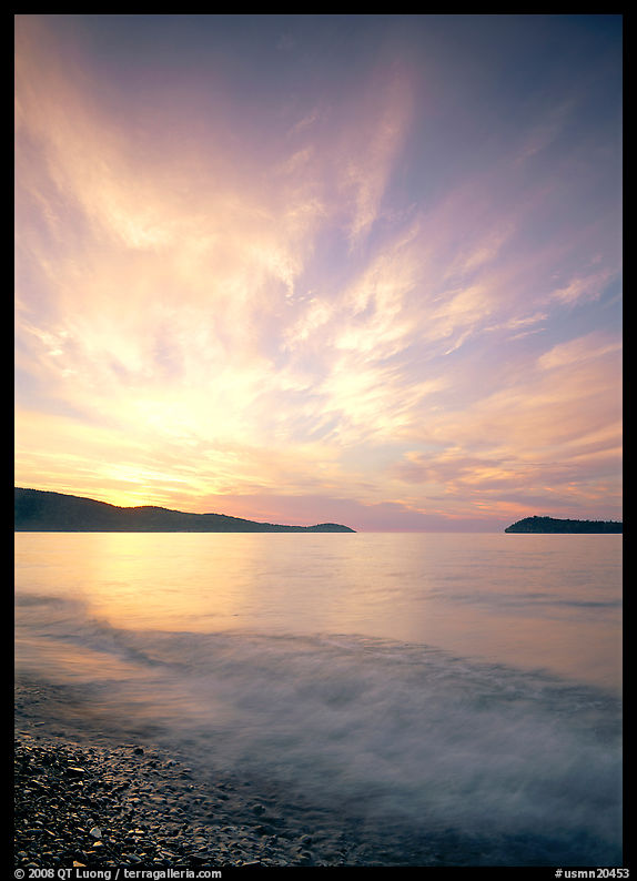 Clouds, surf, and islands near Grand Portage, sunrise. Minnesota, USA