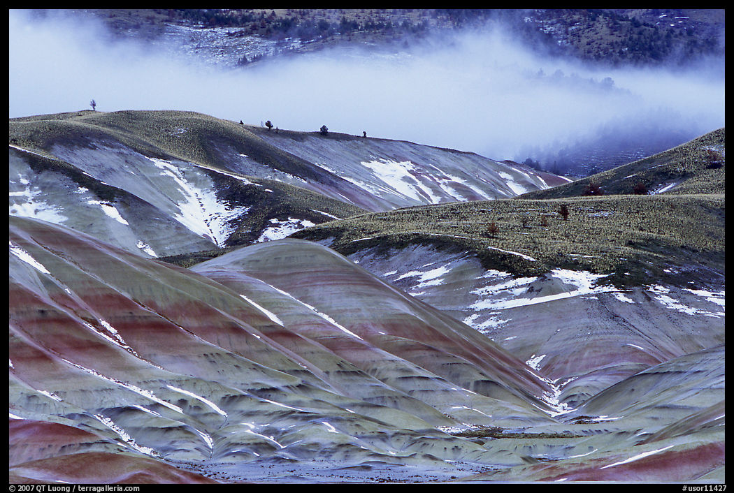 Painted hills with snow and fog. John Day Fossils Bed National Monument, Oregon, USA