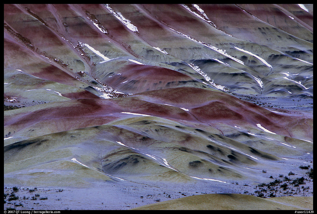Colorful strata and snow on painted hills. John Day Fossils Bed National Monument, Oregon, USA