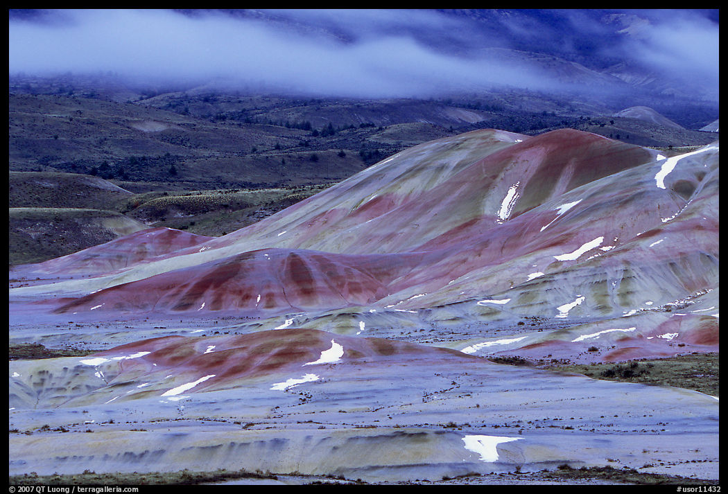 Painted hills and fog, winter dusk. John Day Fossils Bed National Monument, Oregon, USA