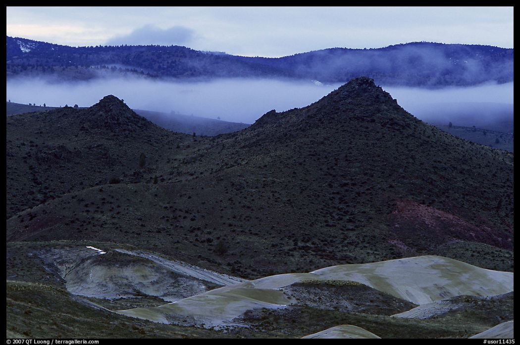 Buttes and fog at dusk. John Day Fossils Bed National Monument, Oregon, USA