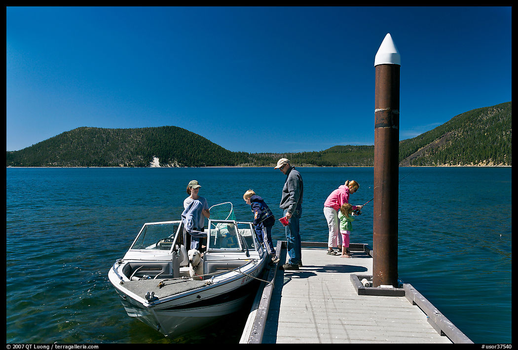 Family boarding boat, East Lake. Newberry Volcanic National Monument, Oregon, USA