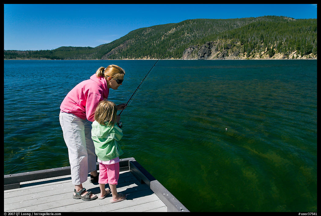 Mother and daughter on deck, East Lake. Newberry Volcanic National Monument, Oregon, USA