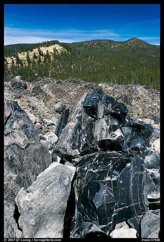 Obsidian and hills. Newberry Volcanic National Monument, Oregon, USA